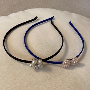 Lot of 2 Girl’s Headband. 1 Black, 1 Blue. Both w/ Ornament. New w/o Tags.